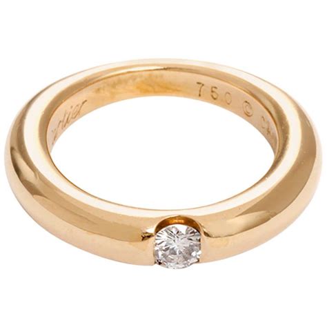 Cartier Ellipse Diamond Gold Solitaire Ring For Sale at 1stdibs