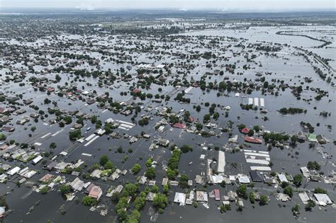 Caught in flooded war zone, families scramble to survive dam collapse in Ukraine | The Times of ...