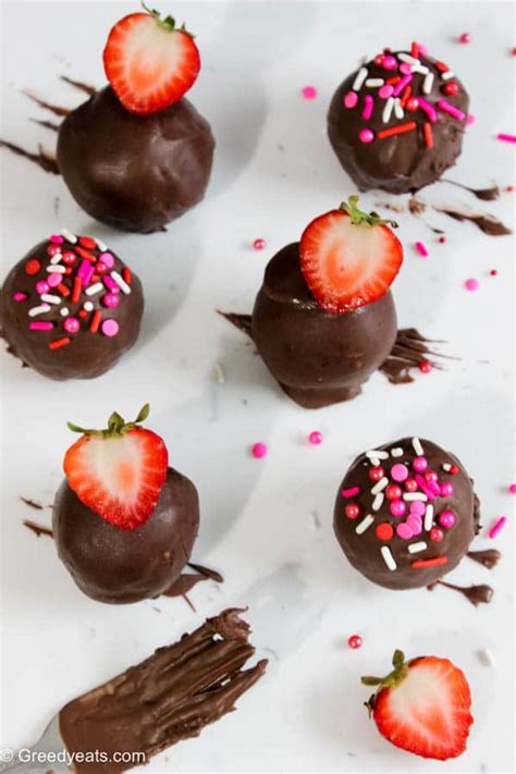 Strawberry cake pops with chocolate coating and sprinkles