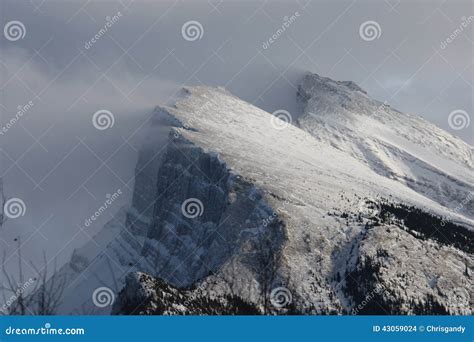 Deep Snow Blowing Off the Top of a Mountain Ridge in the Rockies Stock Photo - Image of blowing ...