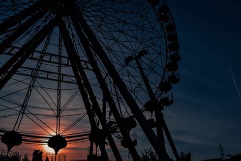 A Silhouette of a Ferris Wheel · Free Stock Photo