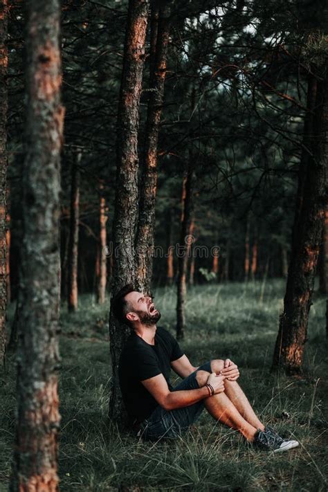 Young Depressed Man Sitting Alone in the Woods Stock Image - Image of ...