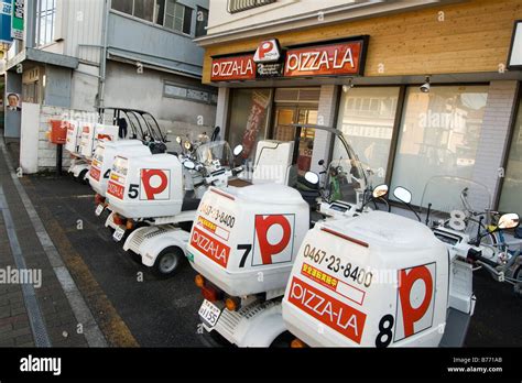 pizza delivery motorcycles parked near pizzeria,Japan Stock Photo - Alamy