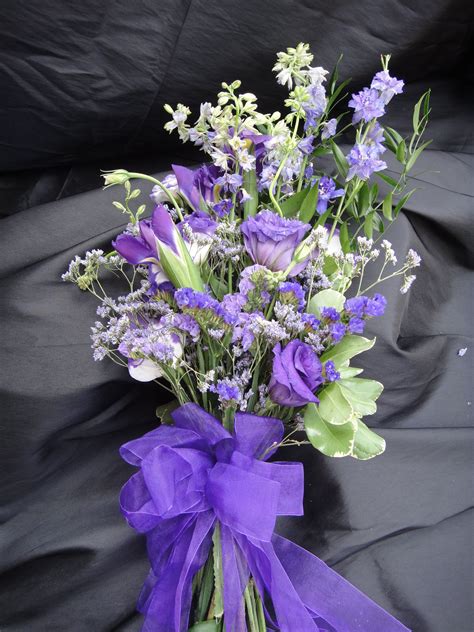 Purple bouquet designed using larkspur, lisianthus, iris, caspia & statice. | Custom wedding ...