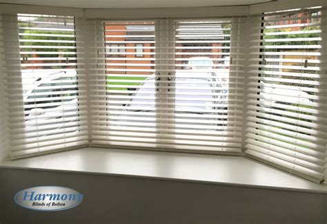 White Wooden Blinds in a Bay Window - Harmony Blinds of Bolton and Chorley