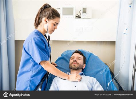 Pretty Nurse Using Stethoscope Examine Male Patient Hospital Room ...