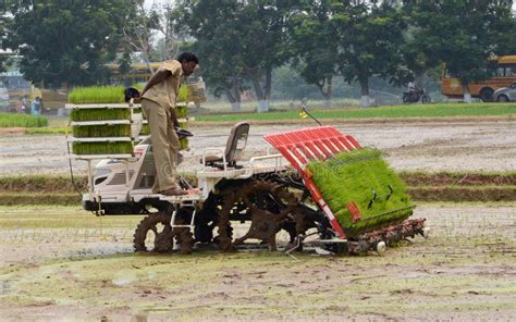 Farmer and plough machine editorial photo. Image of machine - 34615656