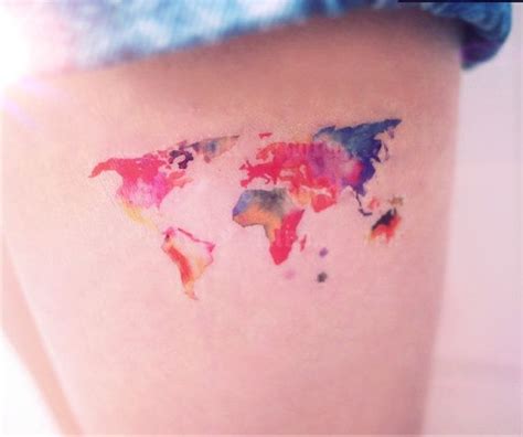 Watercolor world map tattoo on legs