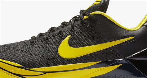 the nike basketball shoe is black and yellow