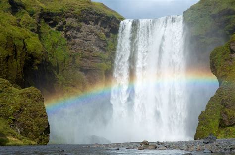 Rainbow in front of a waterfall - Art and Pictures