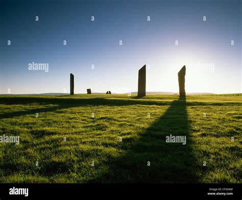 Stones of Stenness stone circle and henge silhouetted at sunrise Stock Photo - Alamy