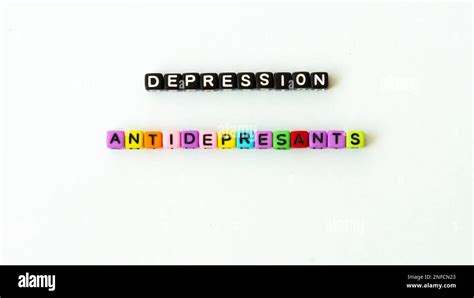 Depression word in black letter beads on white background. Mental health concept. Mock up ...