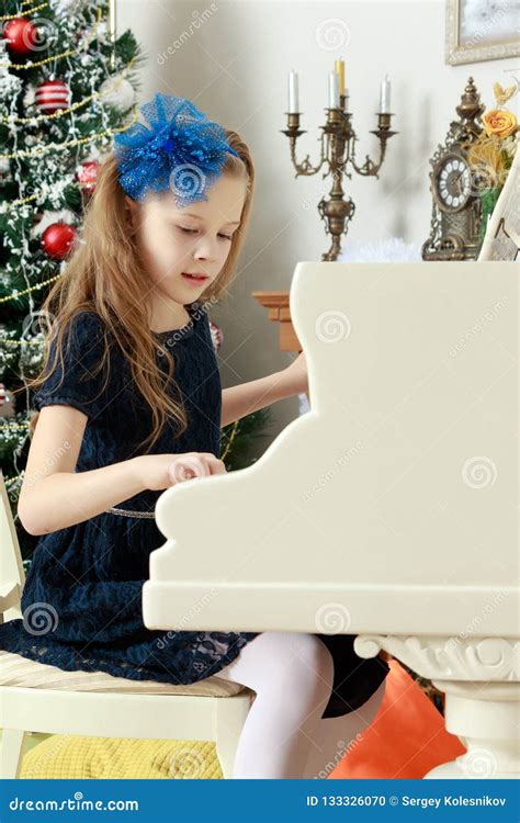 Little Girl at a White Grand Piano. Stock Photo - Image of people, kids ...