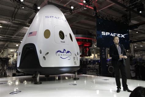 Elon Musk unveils new astronaut-ready spaceship at SpaceX headquarters - Los Angeles Times