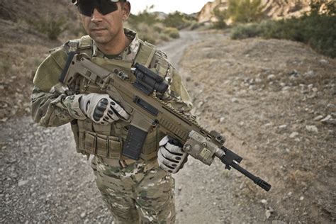 Soldier Holding Gun » Top Defense Systems