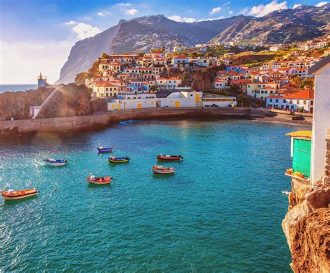 The beautiful fishing village of Camara de Lobos on the portugese ...