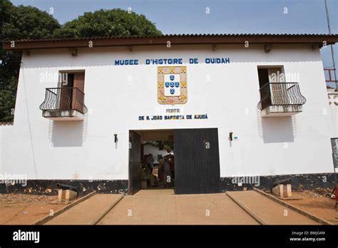 Africa, West Africa, Benin, Ouidah. People at entrance to Musee D ...