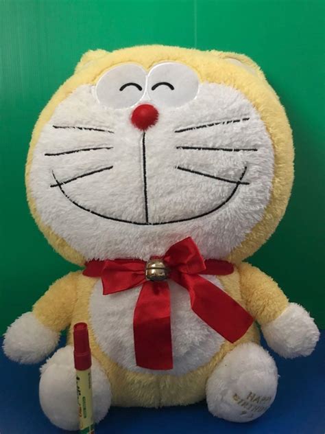 Yellow Doraemon plush, Hobbies & Toys, Collectibles & Memorabilia, Fan Merchandise on Carousell