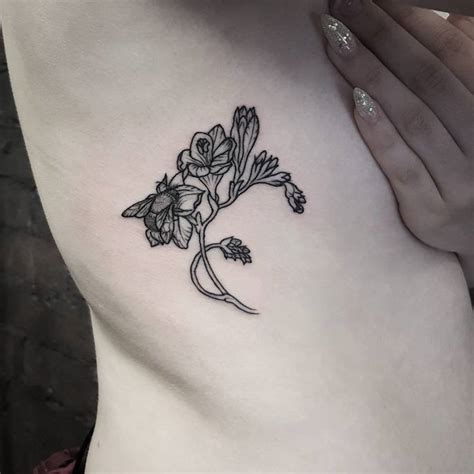 22 Beautiful and Delicate Freesia Tattoo Designs | TattooAdore