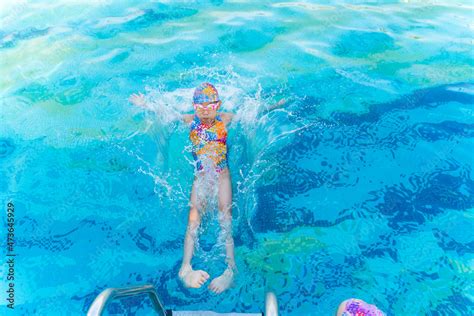 kid jumping in swimming pool Stock Photo | Adobe Stock