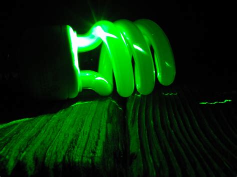 CFL bulb and green laser | Mike Lewinski | Flickr