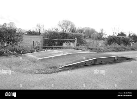 Temporary bridge ramp placed on the road to allow very heavy truck to pass over a weak rural ...