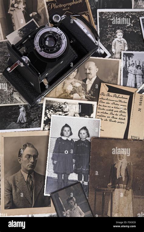 Nostalgic Photographs and roll film camera Stock Photo - Alamy