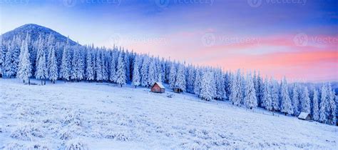 cabin in the mountains in winter 7030213 Stock Photo at Vecteezy