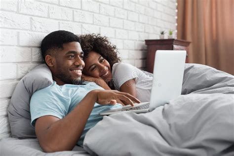 Happy Black Couple in Bed with Laptop at Home Stock Photo - Image of ...