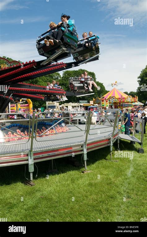 funfair ride fun fair rides waltzer spin around spinning spining spun around being riders fast ...