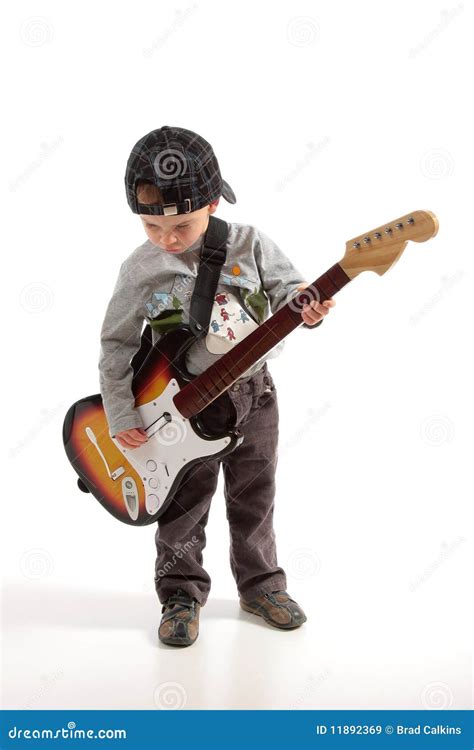 Child playing guitar stock image. Image of musician, electronic - 11892369