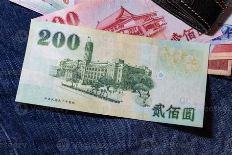 Taiwanese money, Taiwan Banknote, Taiwan dollar on jean background. 6981421 Stock Photo at Vecteezy