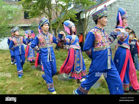 Couples of Chinese Zhuang ethnic group dressed in traditional costumes ...