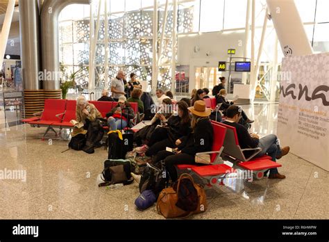 Marrakech airport departures, - people sitting waiting at the gate, departure lounge, Marrakesh ...