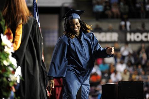 Sand Creek High School graduates receive their diploma during a ...