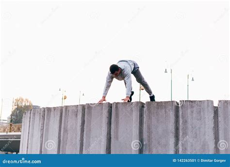 Sportsman Jumping Over Obstacles while Exercising Parkour Tricks Stock ...