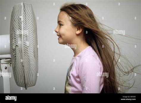 Fan blowing hair hi-res stock photography and images - Alamy