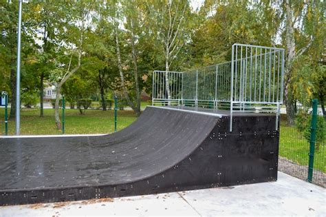 Premium Photo | Skatepark ramps in the park on autumn