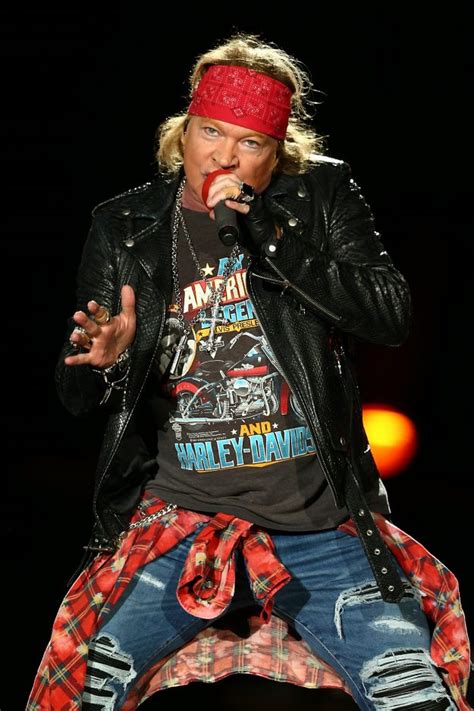 Guns N Roses frontman Axl Rose looks unrecognisable as he signs ...