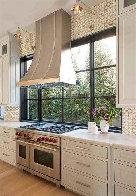 Stainless Steel Vent Hood in Front of Kitchen Windows - Transitional - Kitchen | Kitchen remodel ...