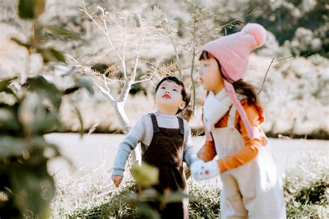 Curious Asian children in nature · Free Stock Photo