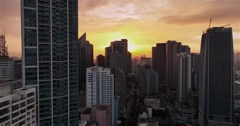 Flying Over The Skyscrapers Of Manila At Sunset, Philippines, Buildings ...