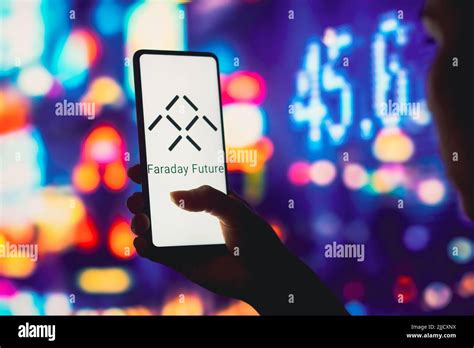 In this photo illustration, the Faraday Future logo is displayed on a smartphone screen. (Photo ...