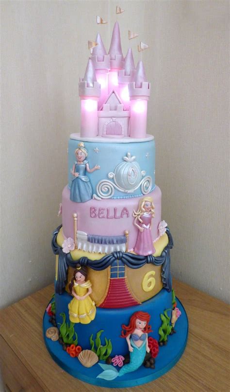 4 Tier Disney Princesses Birthday cake with an Illuminated Castle | Castle birthday cakes ...