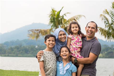 Portrait Of Happy Malaysian Family In The Park Stock Photo - Download ...