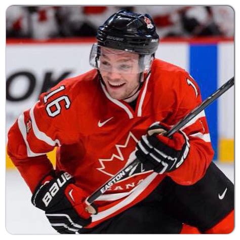 an image of a man that is playing in the ice hockey game and smiling ...