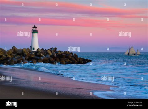 Santa Cruz Breakwater Lighthouse in Santa Cruz, California at sunset ...