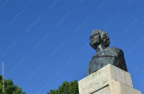 Statue of Romanian poet Mihai Eminescu against blue sky - aspiration ...