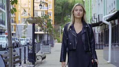 Stunning Person Strolling Through Urban Area Stock Footage SBV-327300163 - Storyblocks