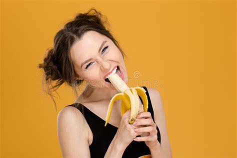 Portrait of Funny Beautiful Young Woman Eating Banana Stock Photo ...